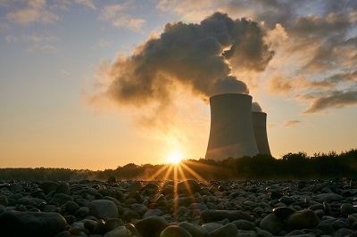 Photo of a nuclear power plant at sunrise