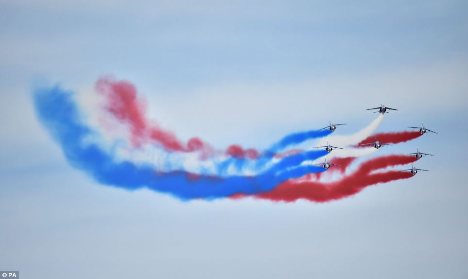 Display: The French Acrobatic Patrol Alpha Jets perform a flypast over Sword Beach to mark the end of the day's events