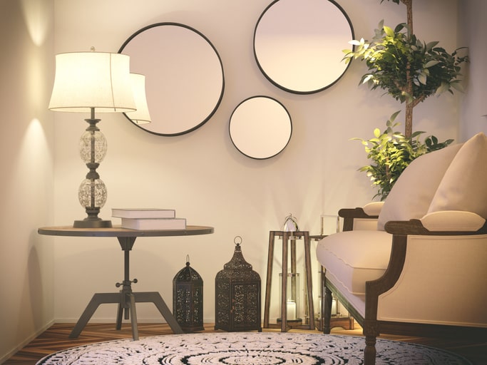 Circular décor mirrors in a small citing room