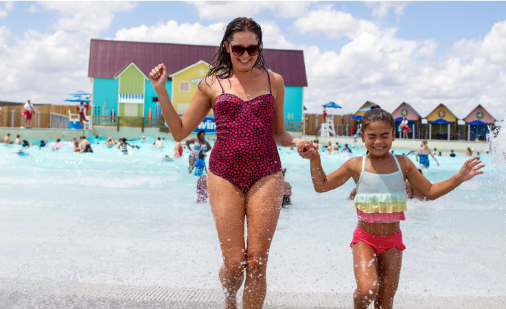 A mother and daughter cool off in the summer at Carolina Harbor Waterpark at Carowinds in Charlotte.