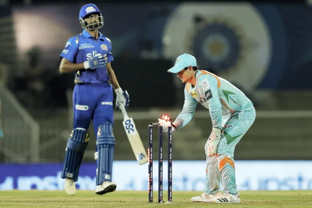 Easy does it! Quinton de Kock knocks off the bails to run Jaydev Unadkat out in the last over