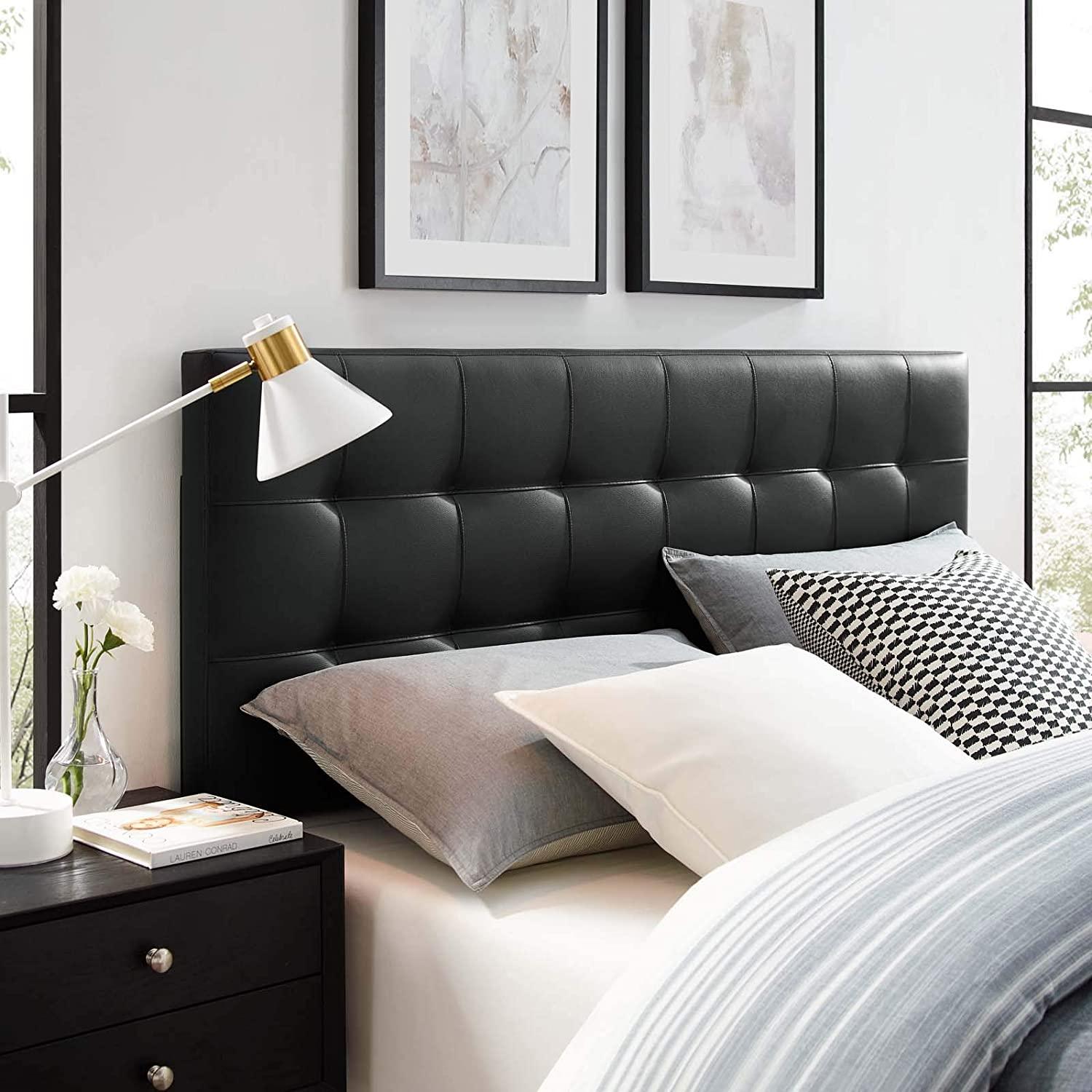An upholstered headboard attached to the wall or bed frame.