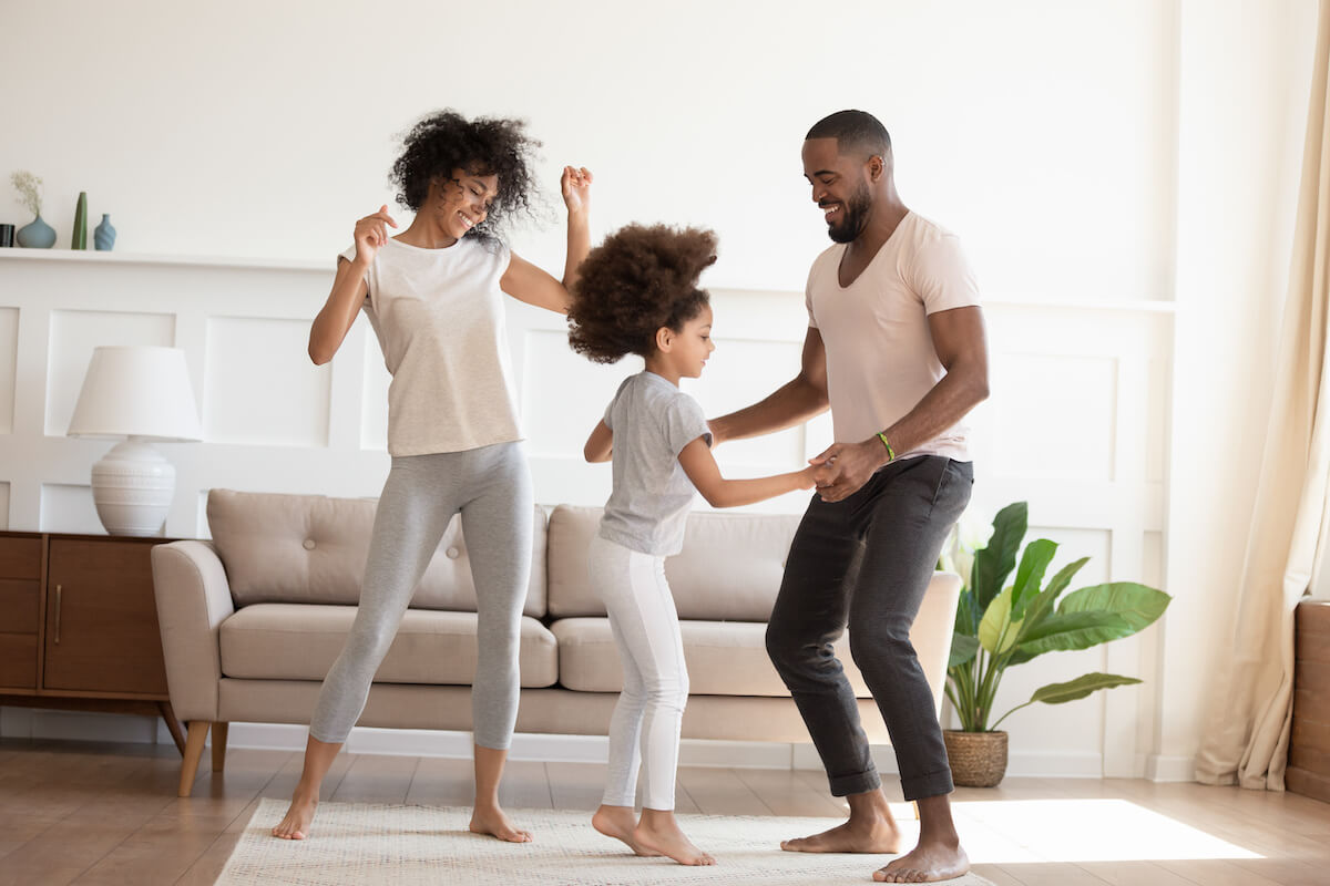 Patient engagement solutions: happy family dancing at home