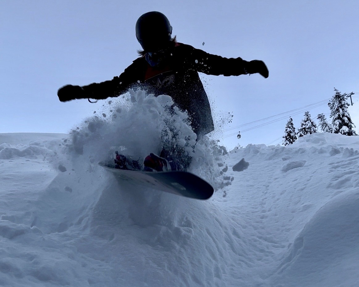 snowboarder riding powder kt22