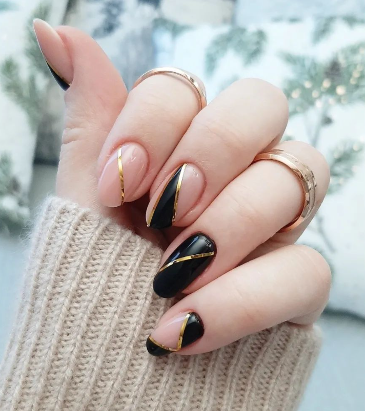 Striped black and gold nail designs