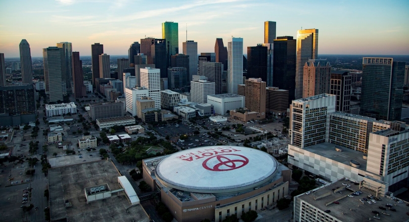 Aerial view of Houston with the Toyota Center in the foreground.