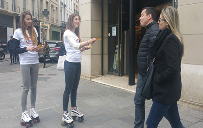 A group of people standing outside a building

Description automatically generated with low confidence