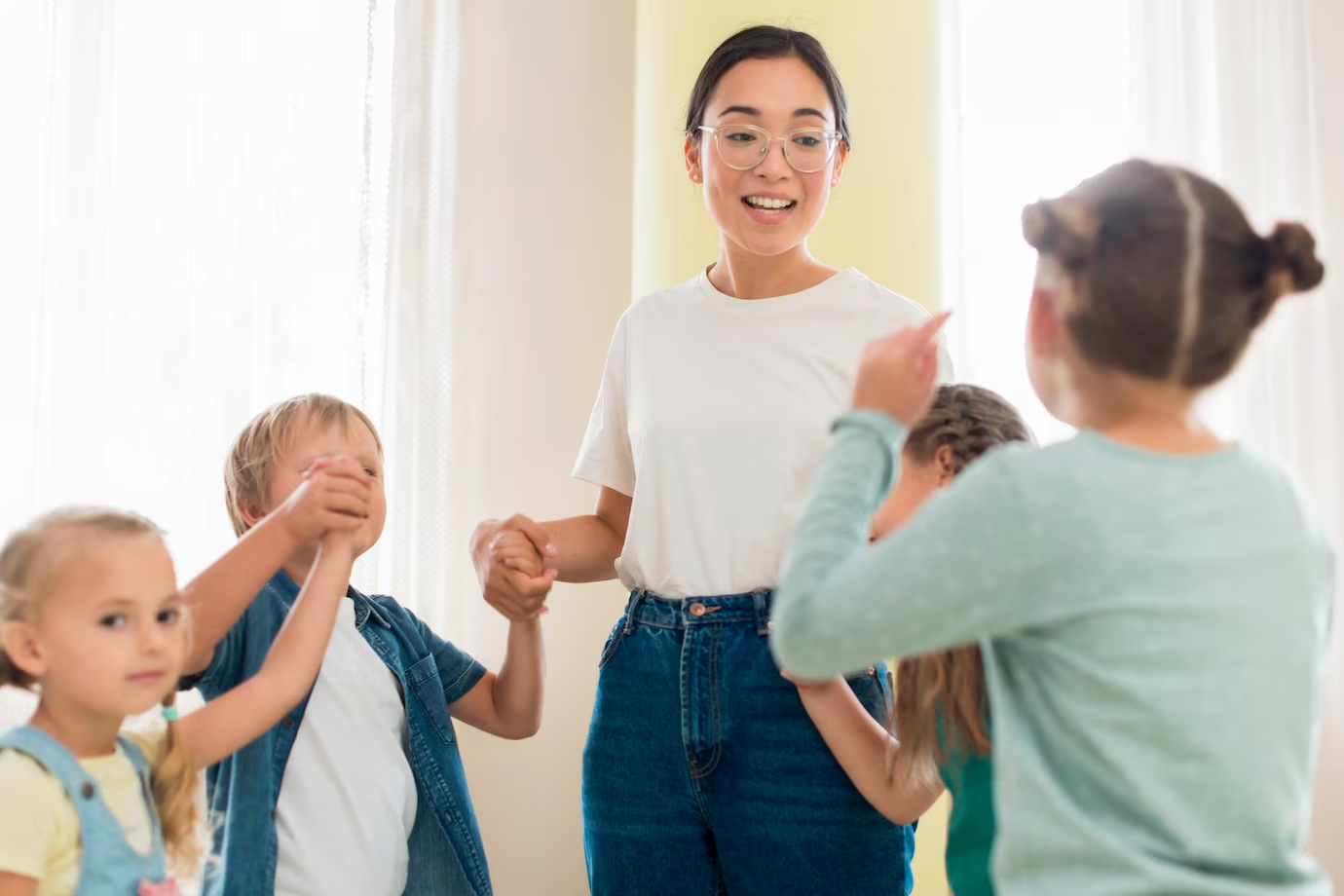 Kid practising voice modulation with teacher 
