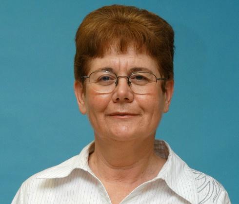 A picture containing person, smiling, posing Description automatically generated