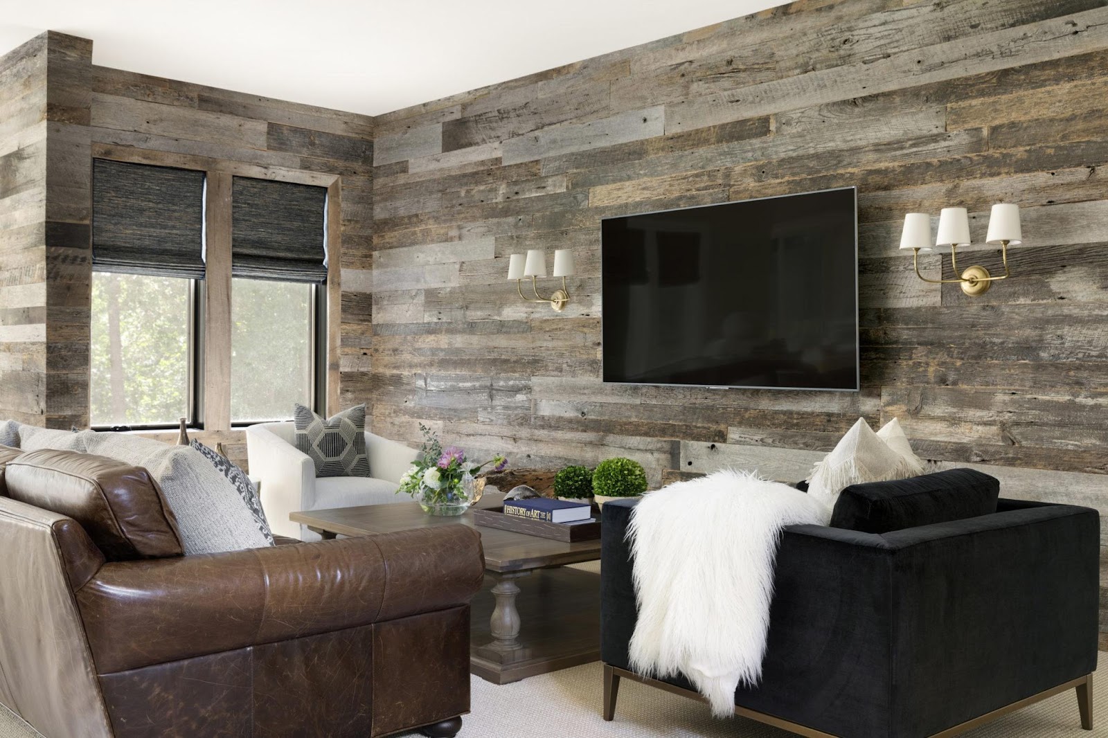 A family room with custom rustic wood walls