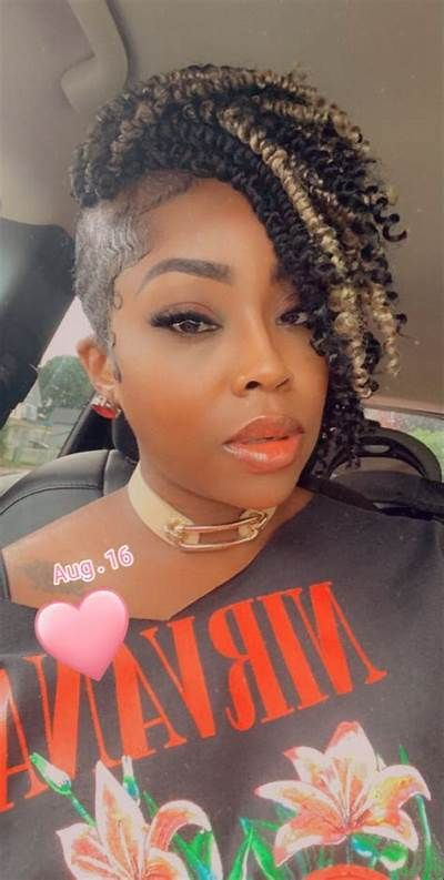 Lady shows off  this shaved cut  with the curly twist 