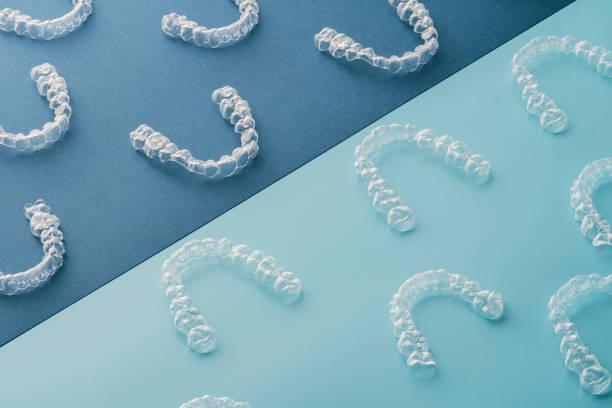 Transparent invisible dental aligners or braces aplicable for an orthodontic dental treatment Dental aesthetic ortodontics invisalign oral health stock pictures, royalty-free photos & images