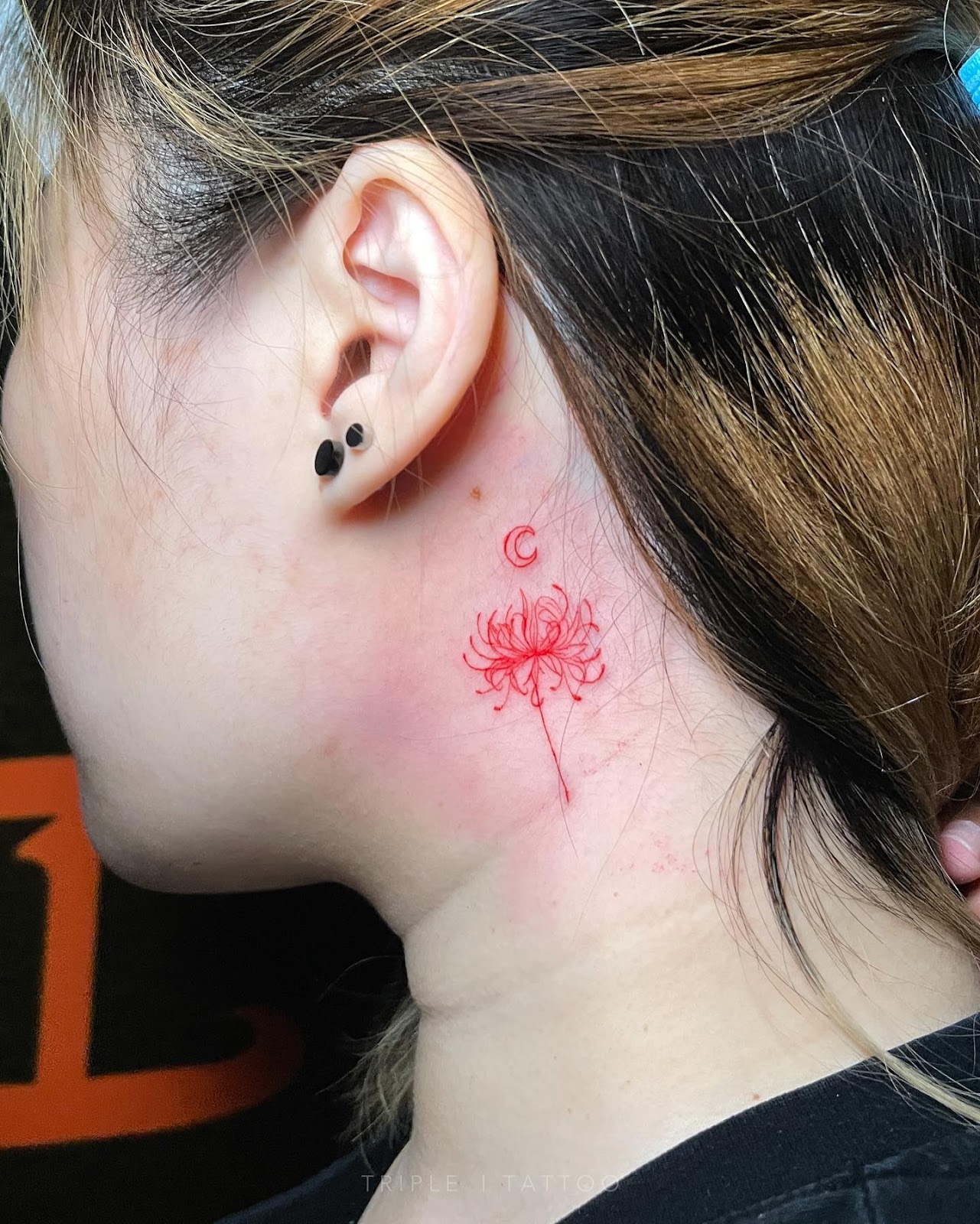 Red Spider Lily Behind The Ear Tattoo