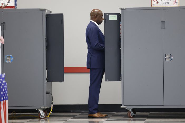 U.S. Senate Raphael Warnock cast his vote during the first day of early voting of the general elections on Monday, October 17, 2022. The final day of in-person early voting is Friday, November 4. Election Day is Tuesday, November 8. Miguel Martinez / miguel.martinezjimenez@ajc.com