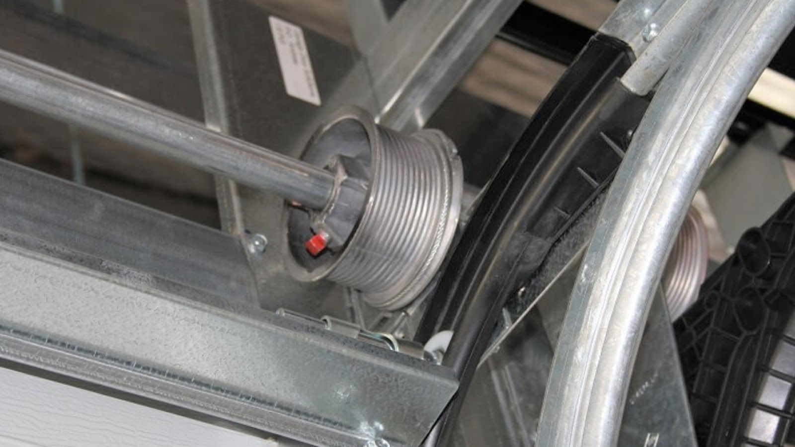 A close-up shot of garage door cable drums