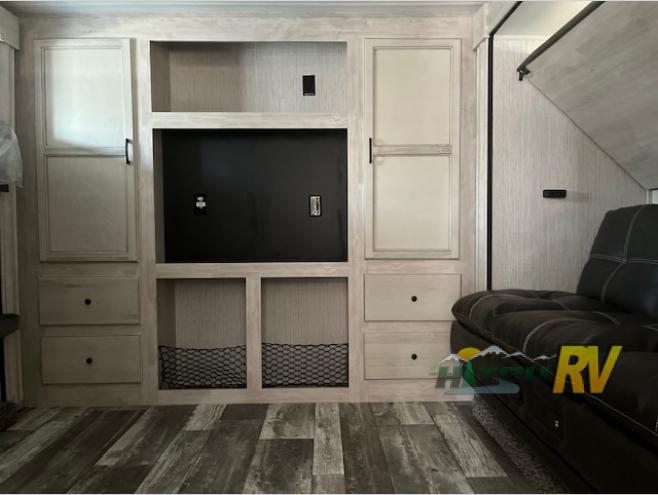 The bunkhouse features an entertainment center and plenty of storage.