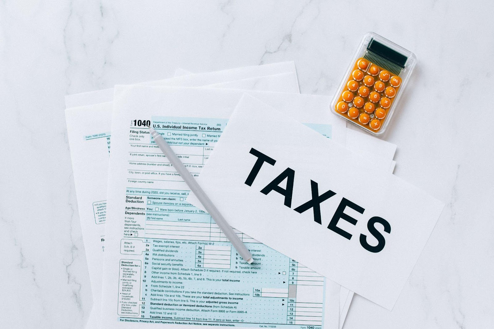 a tax return paperwork with calculator