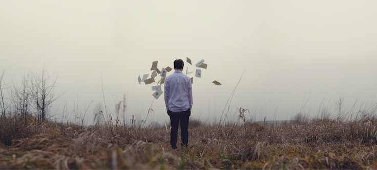 Man in the field with a cloudy sky