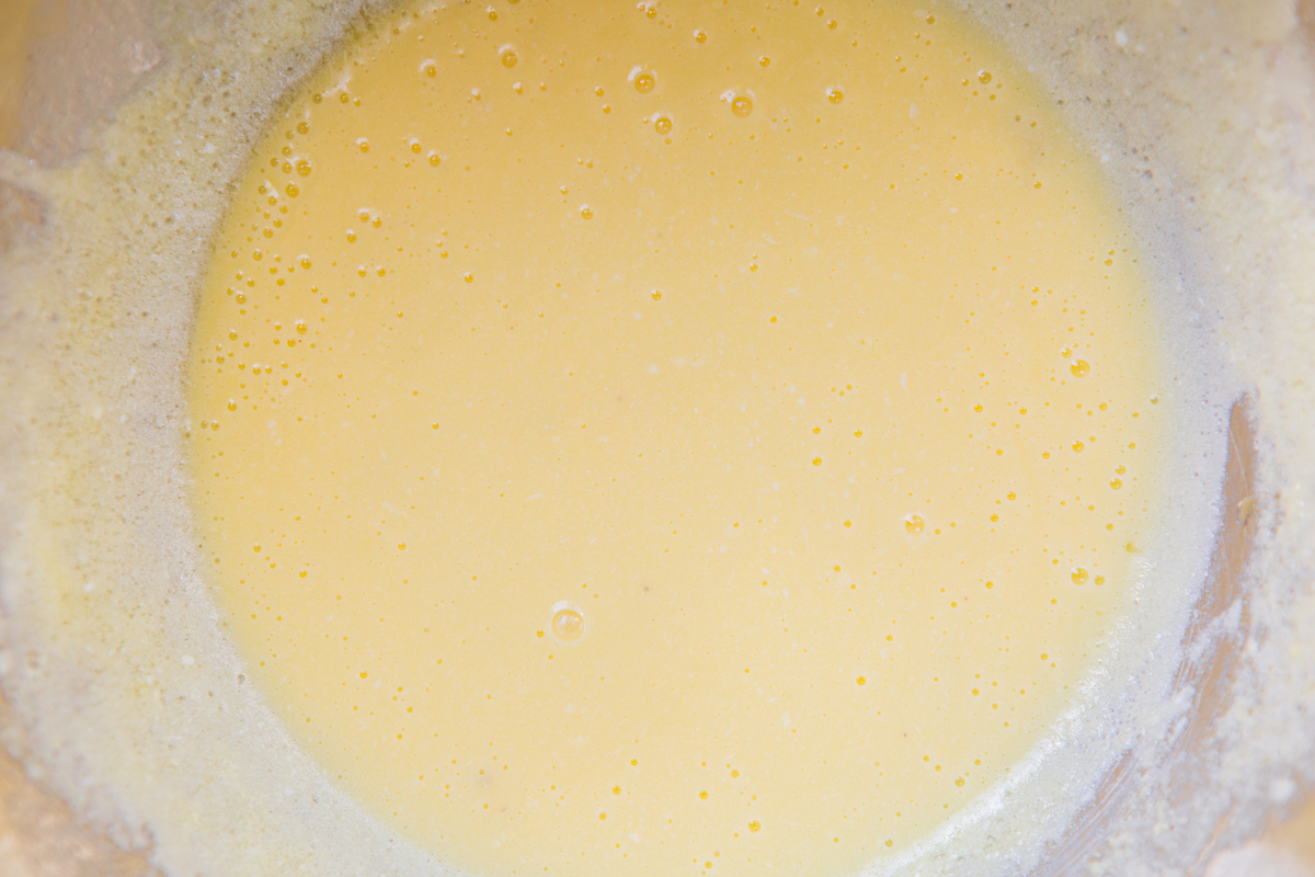 egg yolks in a bowl making a hollandaise sauce