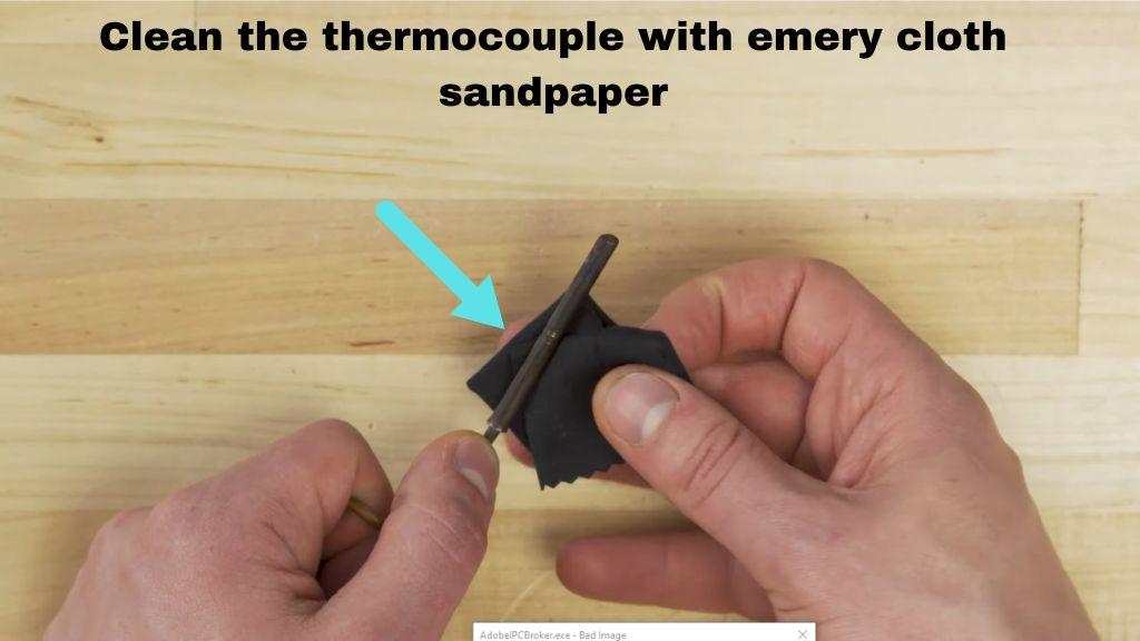 clean the thermocouple with emery cloth sandpaper