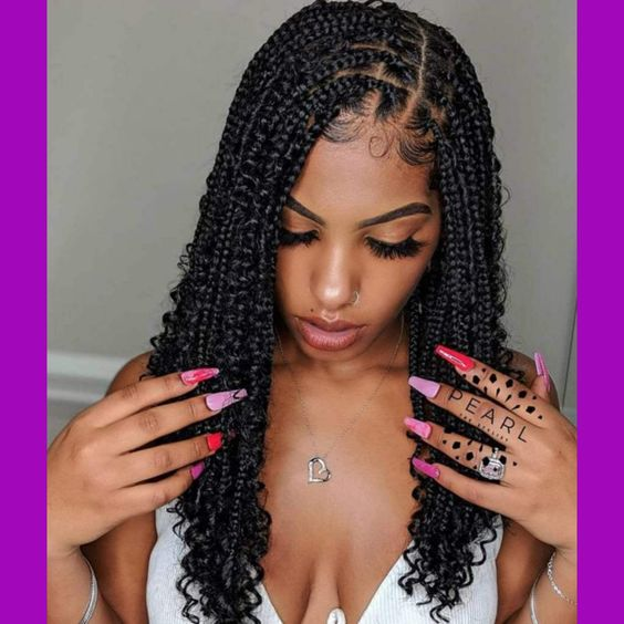 pretty lady wearing butterfly braids with colorful nails