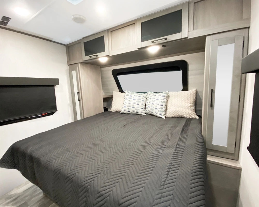 Dutchmen Kodiak Ultimate 2921FKDS interior of camper with king bed