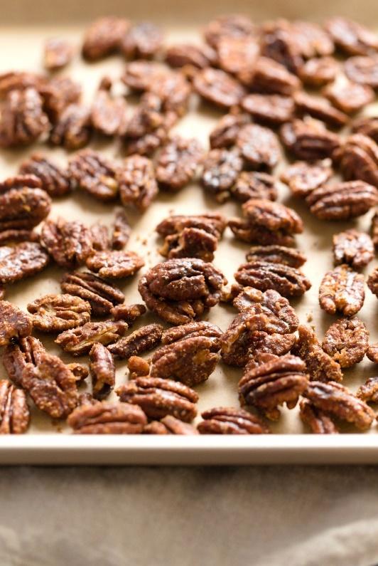 Vegan Candied Pecans on parchment lined sheet