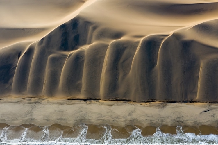 Dunes flowing into the South Atlantic Ocean