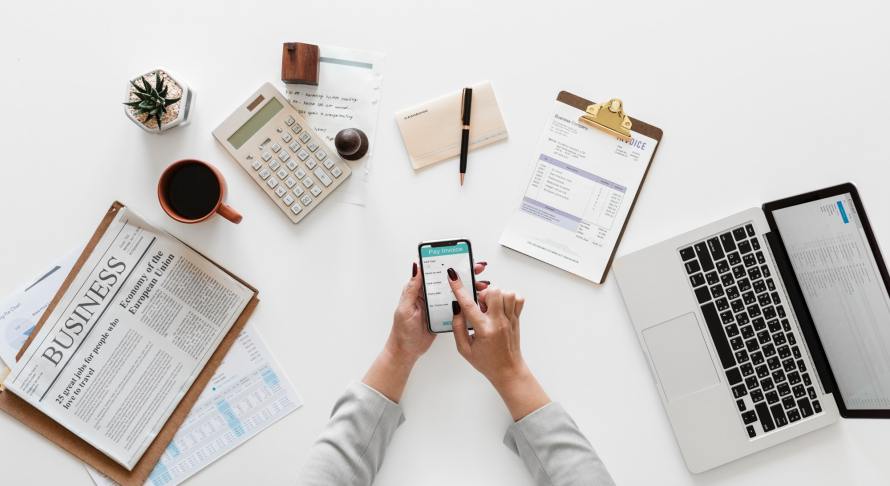 a person at a desk doing some financial-related work