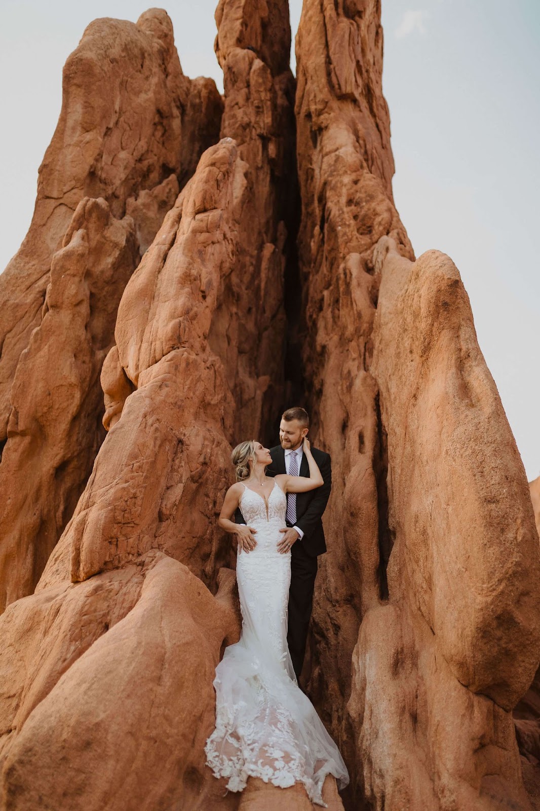 Garden of the Gods elopement couple between red rocks