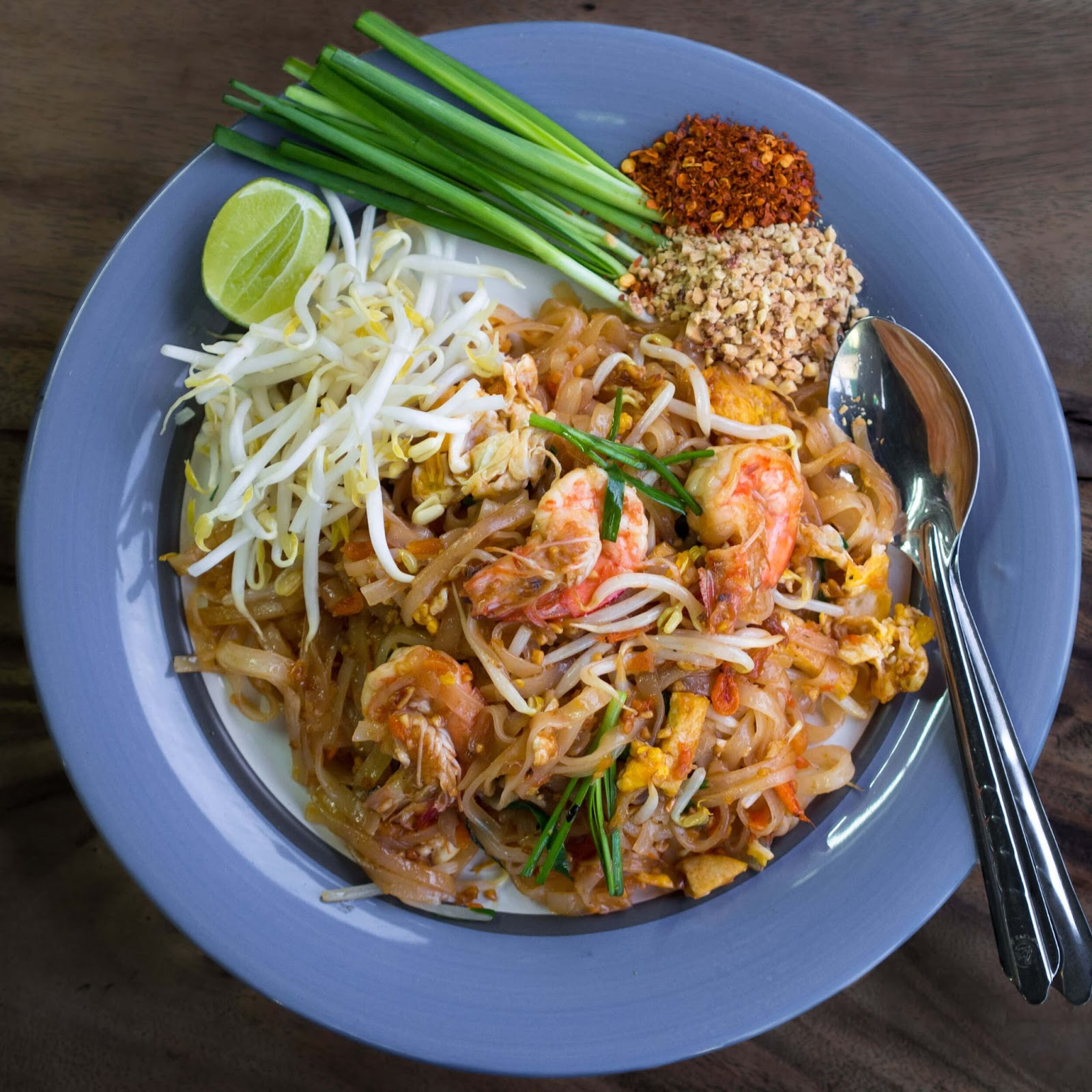 Pad Thai, 50 Best Foods In The World, rice noodles, peanuts, scrambled eggs, chicken, beef, and bean sprouts