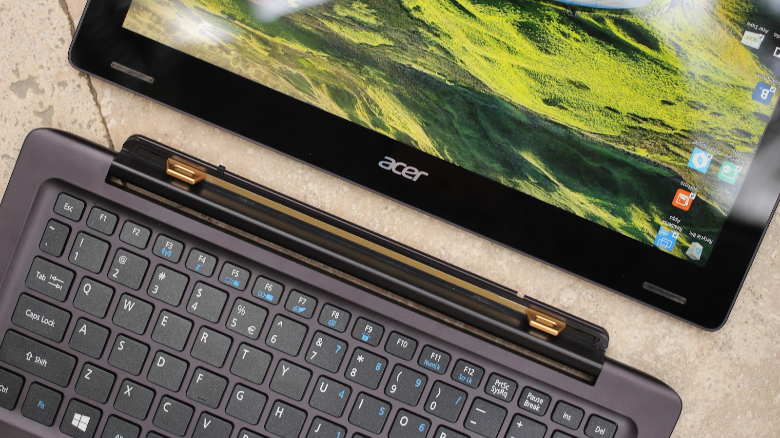 This image shows the Acer laptop in convertible shape. The display and keyboard is separated to each other.
