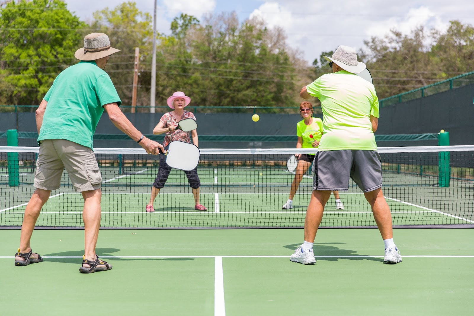 A game of mens vs womens pickleball doubles.