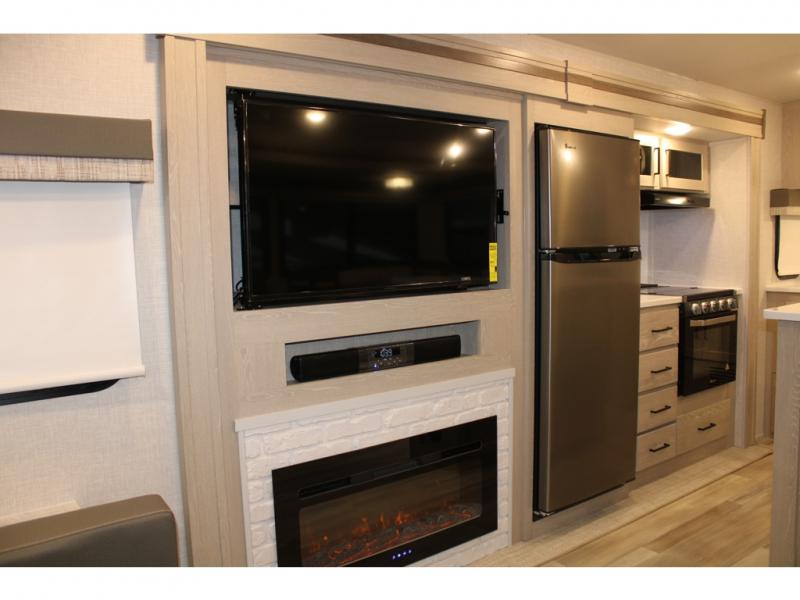 The entertainment center in this unit is perfect for family movie nights at the campground.