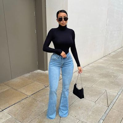 Woman wearing black turtleneck flared jeans
