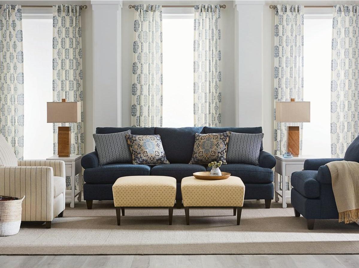 Blue Sofa, Yellow Ottomans, & Accent Chairs in Living Room