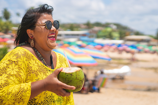 a woman in a yellow shirt
enjoying some time while travelling to overcome travel anxiety