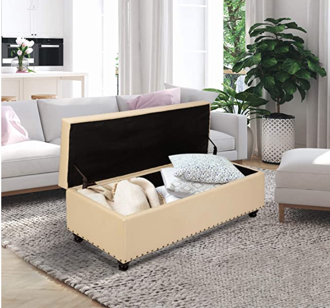 Space-savers for small apartments: Open beige chest with pillows inside in living room