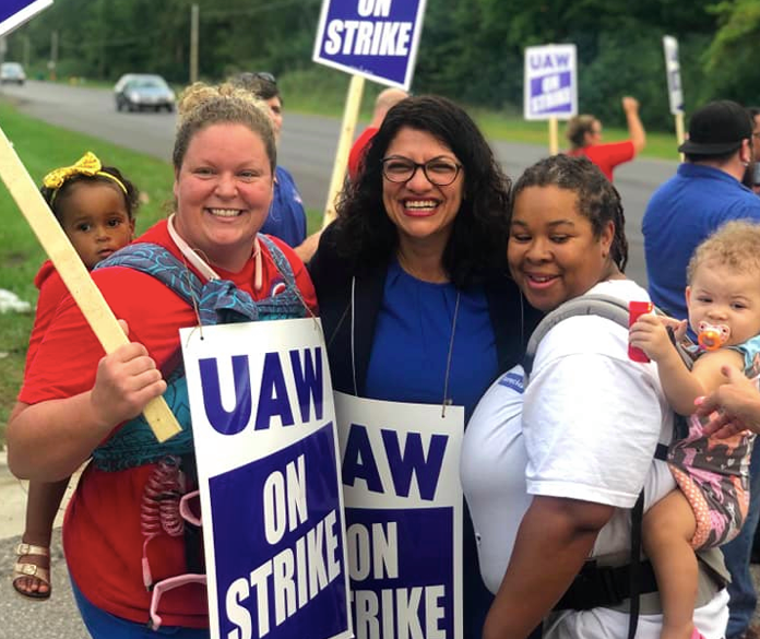 Image of Rashida with striking UAW workers