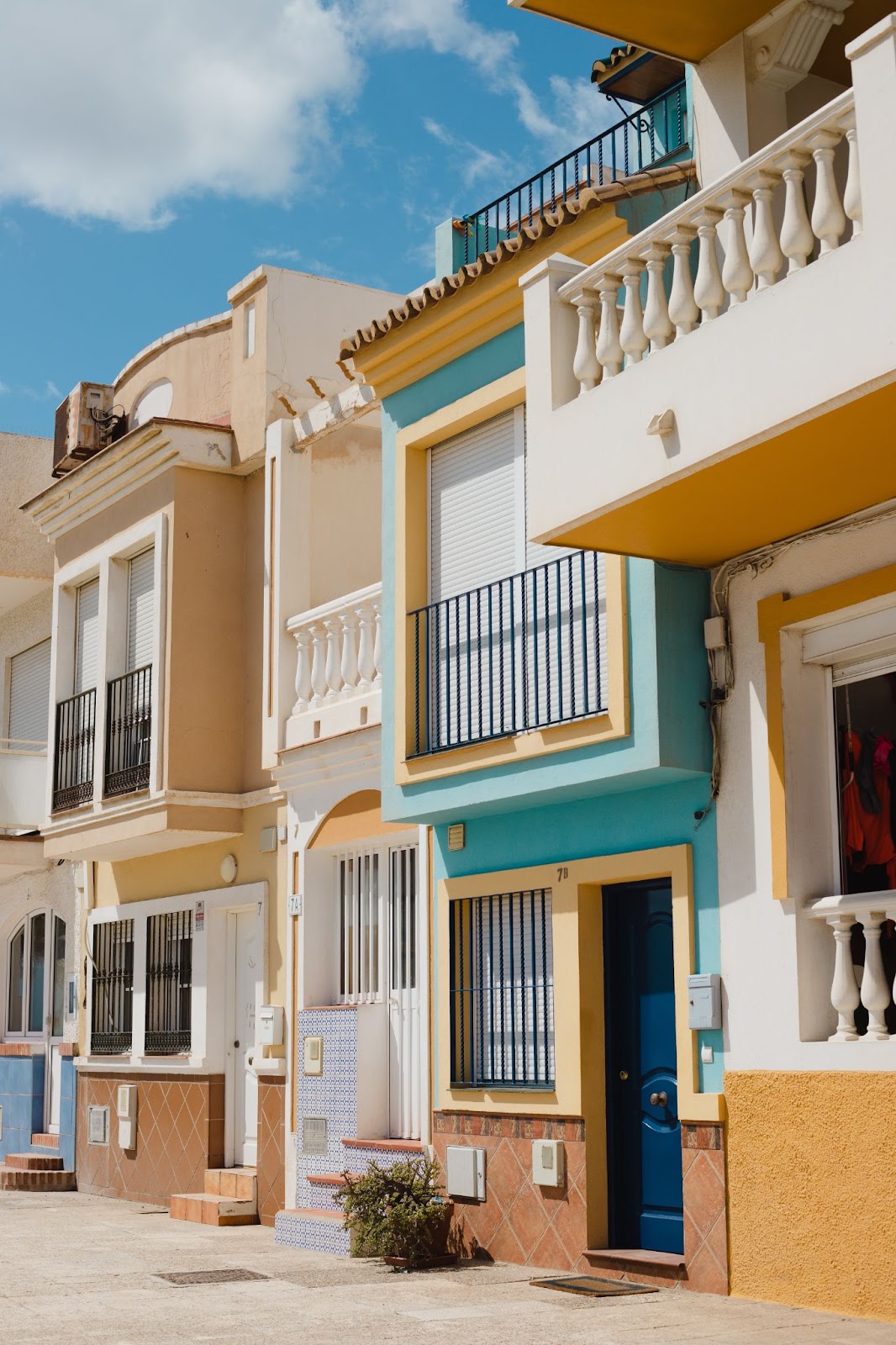 Colourful Mediterranean street featuring terracotta tiles