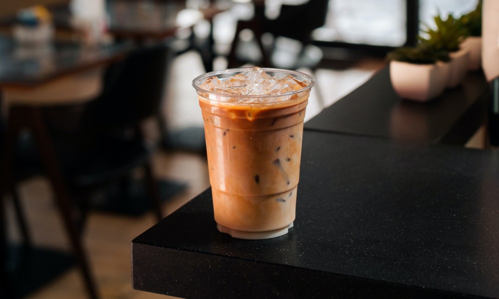 Close up image of cold brew coffee in PET recyclable plastic takeaway coffee cup