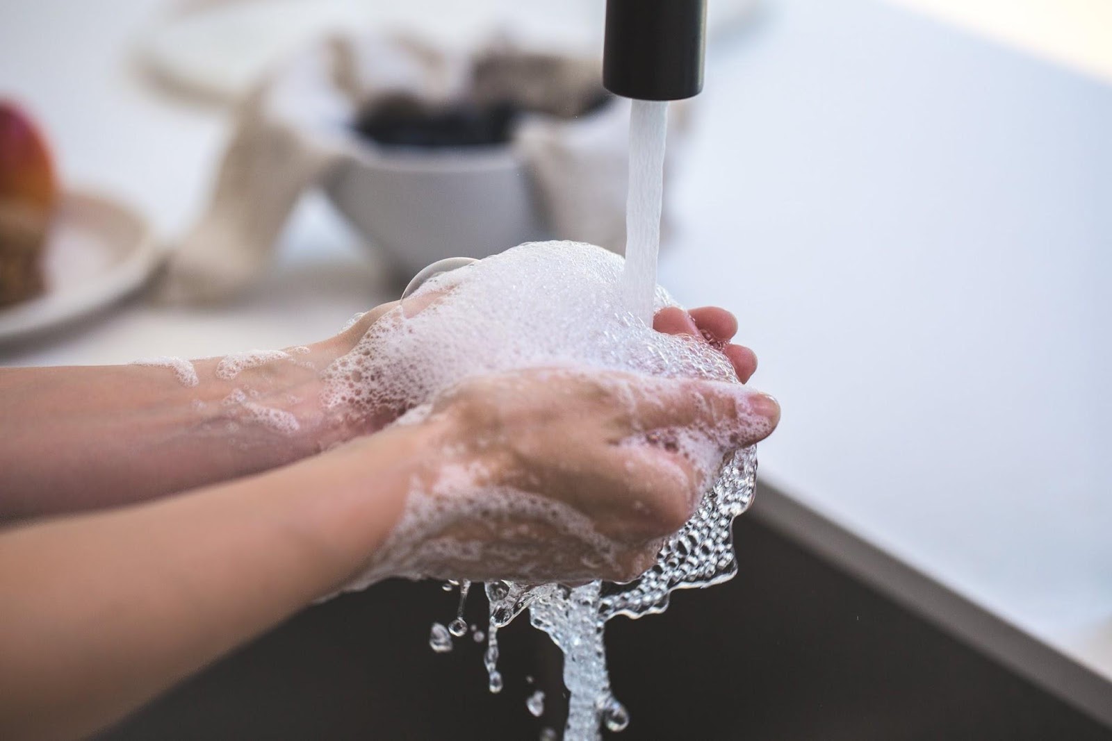 Making Sure Your Home Has Everything You Need - Running water washing hands