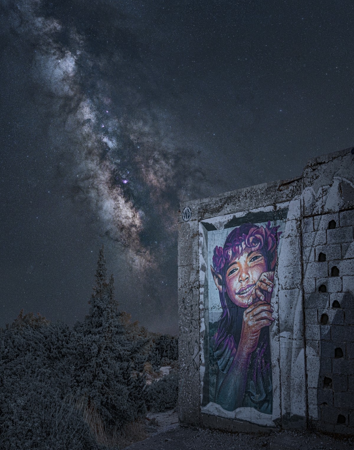 Milky Way viewed behind a graffiti of Pandora by Wild Drawing (WD) a Balinese artist on the Greek island of Naxos