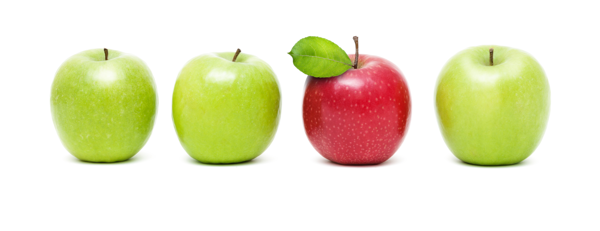 image of four apples, three being green and one red