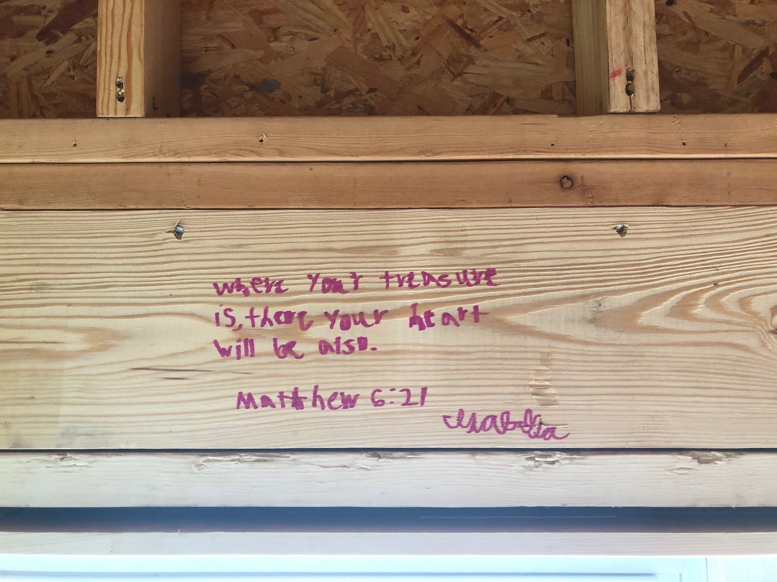 scripture written on studs of new build home matthew 6:21