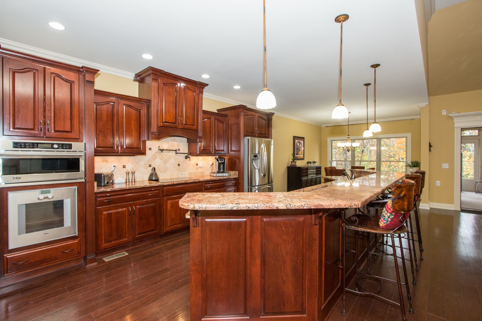 Beautiful gourmet kitchen features cherry cabinets, granite countertops!  This kitchen is open to the spacious Great Room for great entertaining!  This kitchen is in 10901 Jordain Drive, Louisville KY 40241, currently listed by Pam Ruckriegel 502-435-5524.