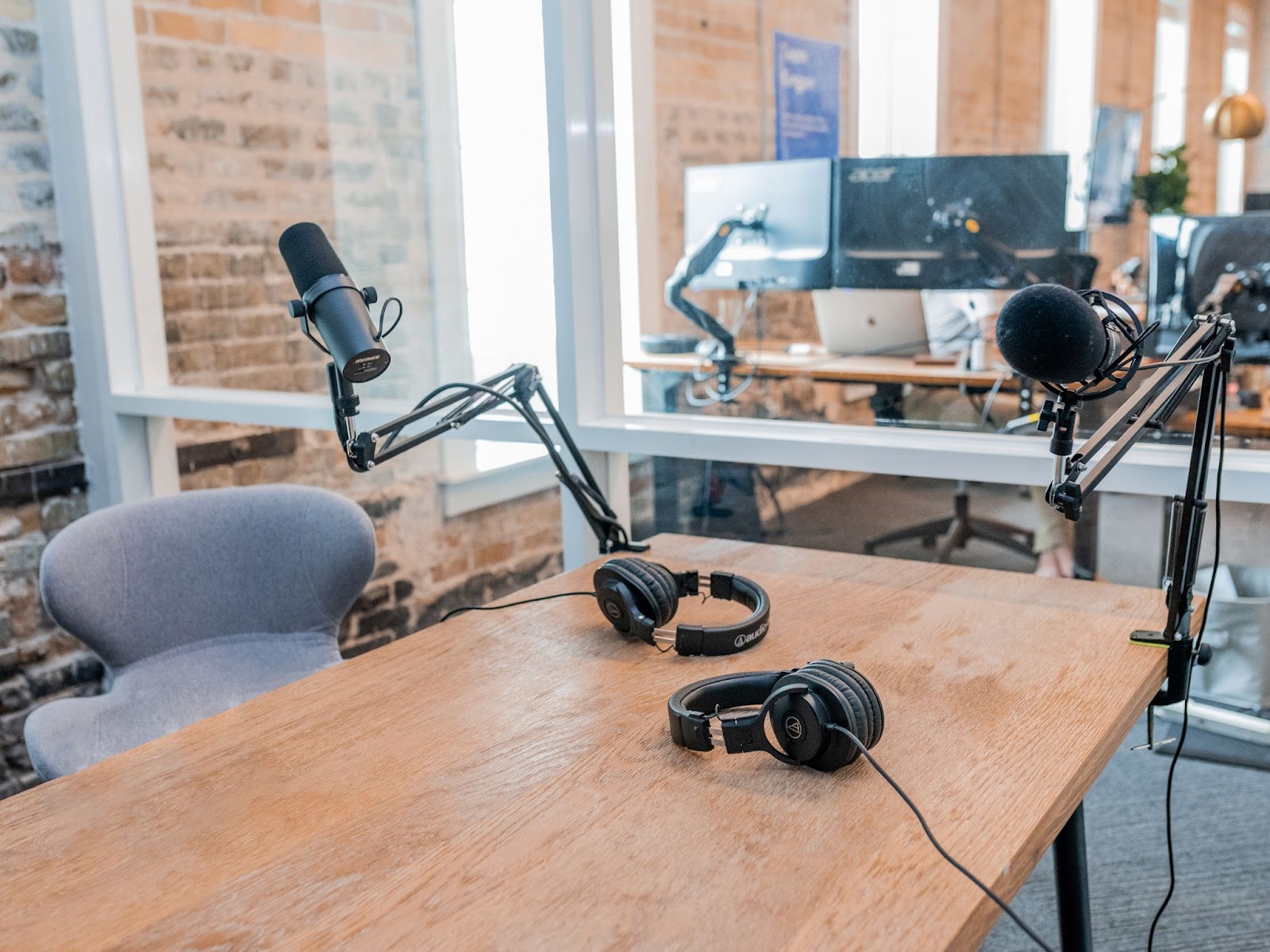 podcast studio with microphone and brick wall 