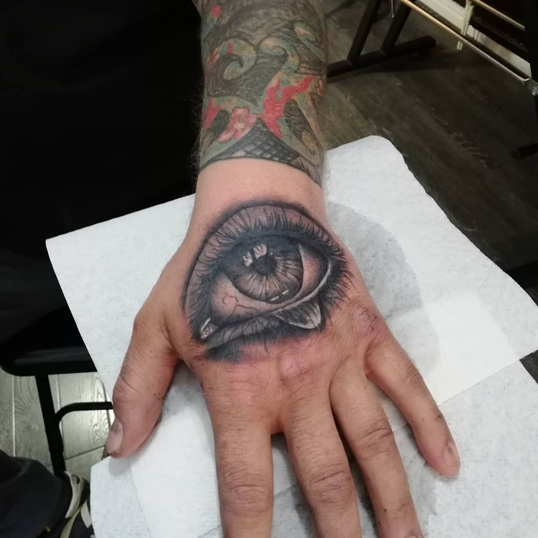Black And Grey Tear Eye Tattoo