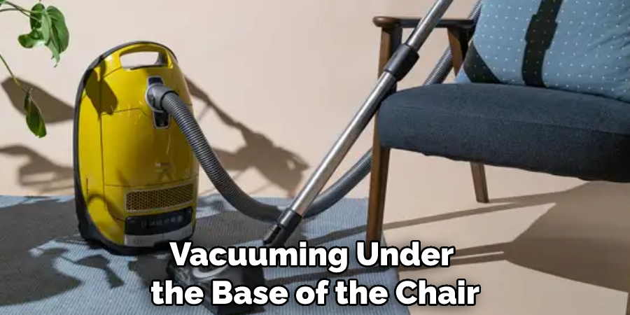 Vacuuming Under the Base of the Chair