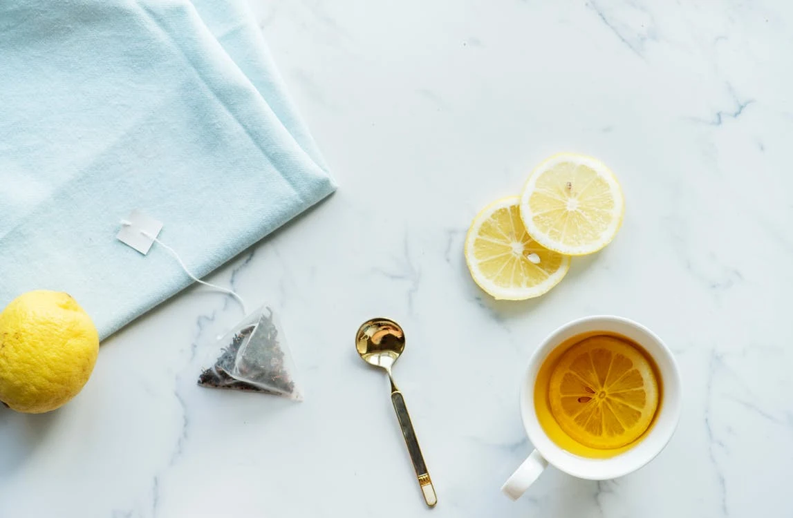 lemon on kitchen counter with tea bag